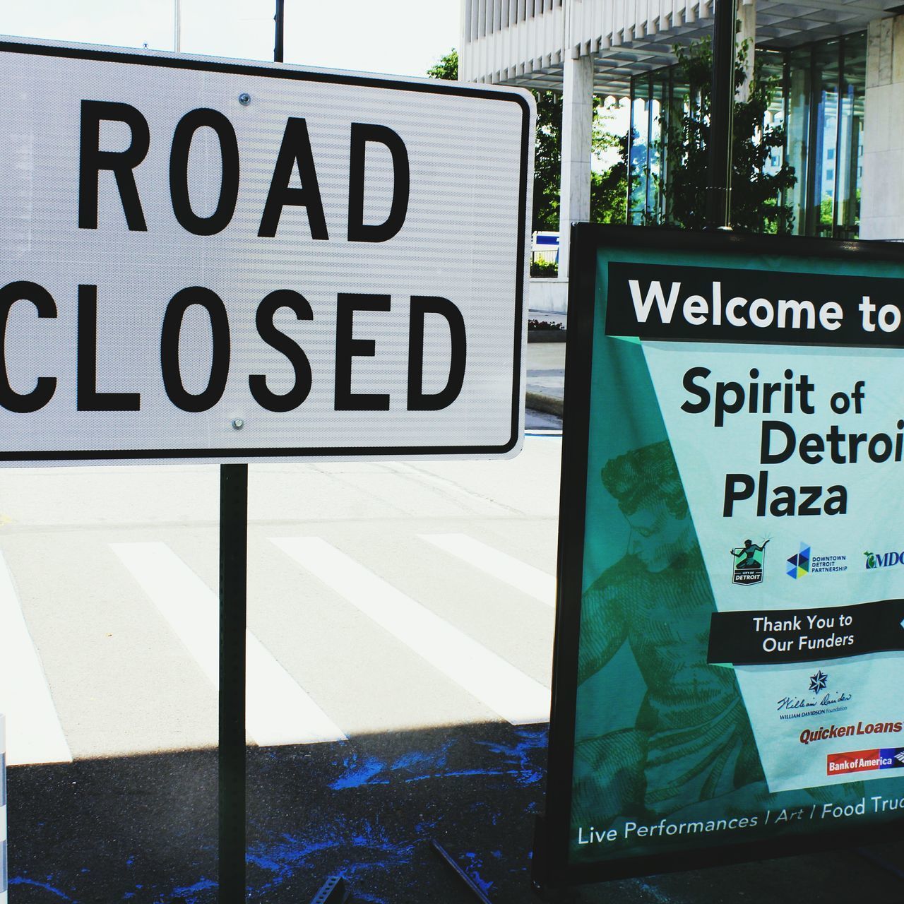 CLOSE-UP OF SIGNBOARD ON ROAD