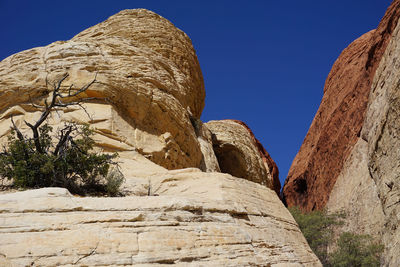 Low angle view of rock formation against sky