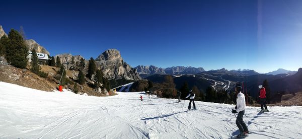 Scenic view of mountains against blue sky