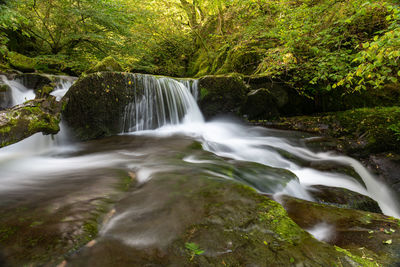 Long exposure of a waterfall on the hoar oak water river at watersmeet in exmoor national park