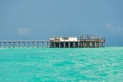 Pier over sea against sky