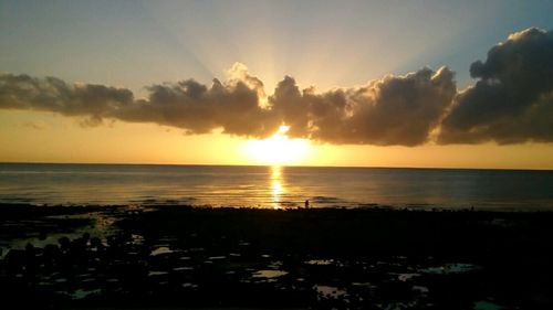 Scenic view of sea at sunset