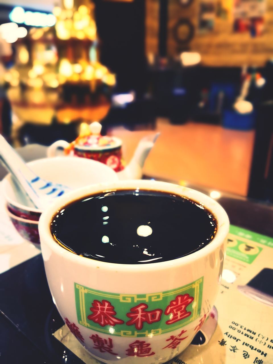 CLOSE-UP OF TEA SERVED ON TABLE IN RESTAURANT