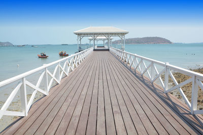 Pier over sea against sky