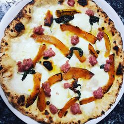 High angle view of pizza served on table