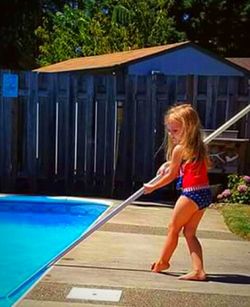 Woman standing in swimming pool