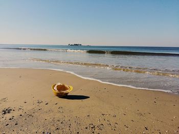 Scenic view of beach against clear sky