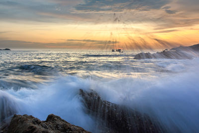 Scenic view of sea against sky during sunset