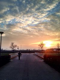 View of footpath at sunset
