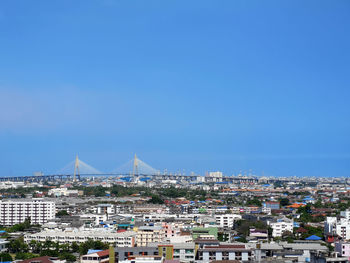 High angle view of townscape against blue sky