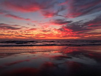 Scenic view of sea against romantic sky at sunset