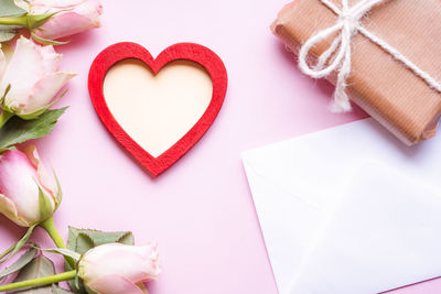 Close-up of heart shape and flowers with gift box