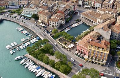High angle view of city by river and buildings