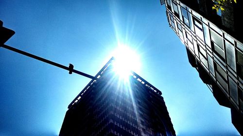 Low angle view of bright sun