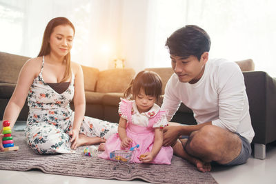 Family playing with toys at home