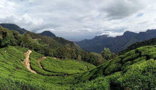 Scenic view of mountains against cloudy sky