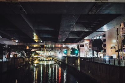 High angle view of illuminated bridge in city at night