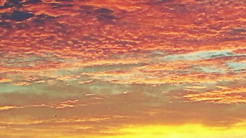 Low angle view of cloudy sky at sunset