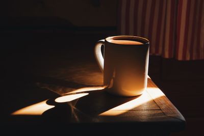 Close-up of cup on table