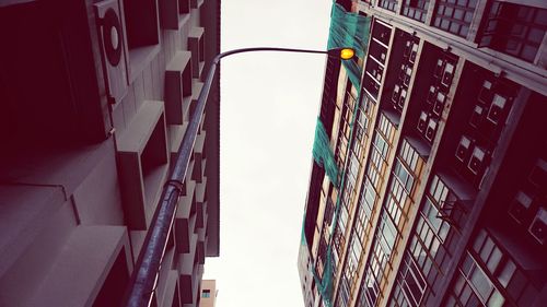 Low angle view of skyscrapers against sky