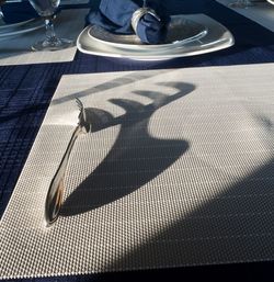 Close-up of fork on place mat