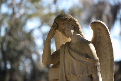 Low angle view of statue against blurred background