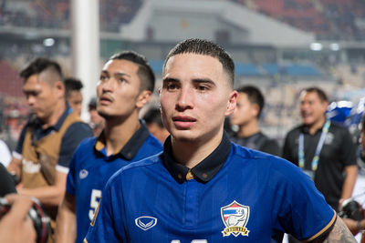 Close-up of friends on soccer field