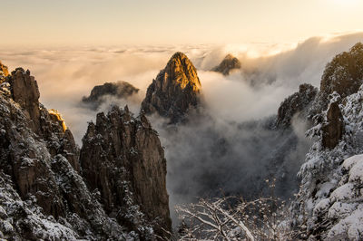 Panoramic view of mountains against sky during winter