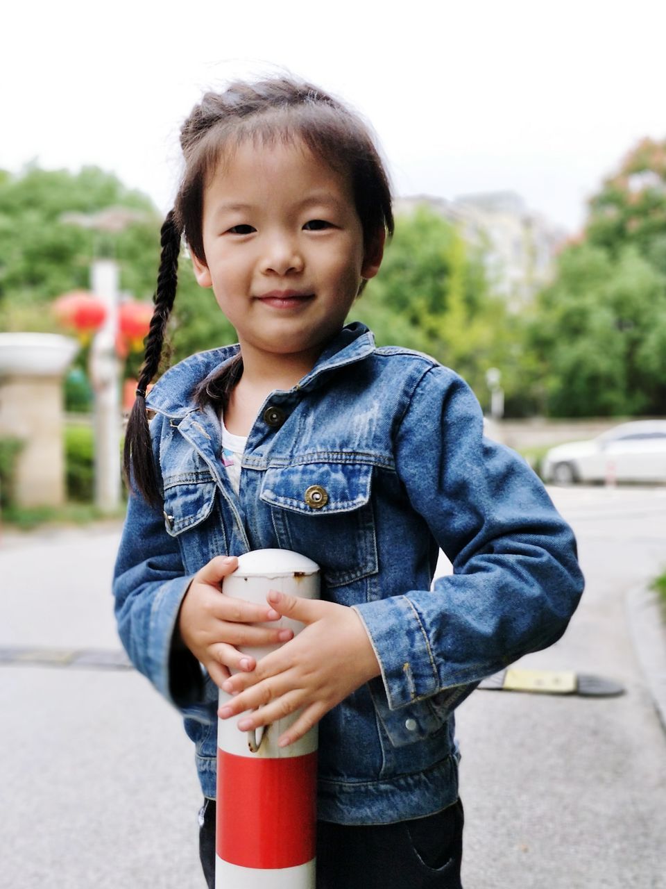 looking at camera, real people, portrait, one person, childhood, casual clothing, outdoors, front view, elementary age, holding, day, focus on foreground, boys, freshness