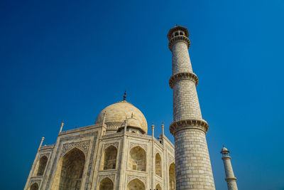 Low angle view of historical building against blue sky