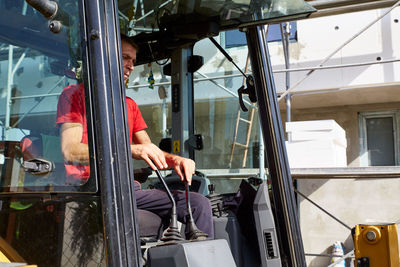 Midsection of man working in factory