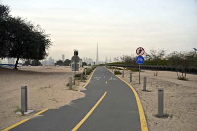 Dubai skyline from nad al sheba bicycle track road, dubai, united arab emirates