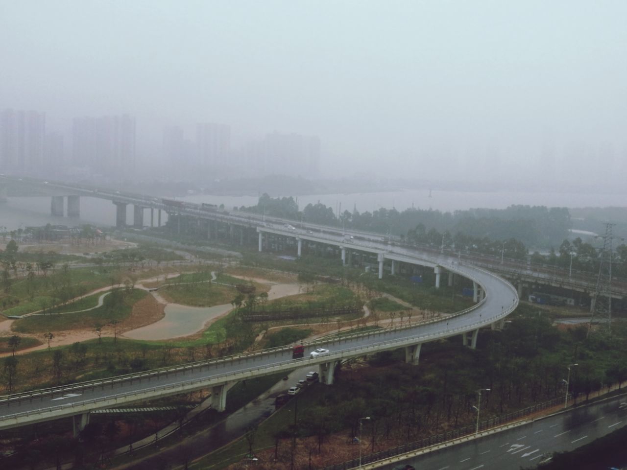 HIGH ANGLE VIEW OF ROAD IN FOGGY WEATHER