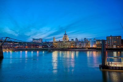 Illuminated city at waterfront