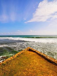 Scenic view of sea against cloudy sky