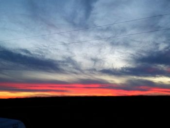 Silhouette landscape against sky during sunset