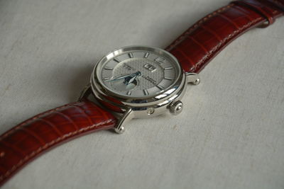 High angle view of clock on table