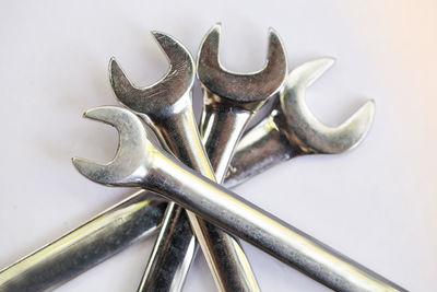 High angle view of chain on table against white background