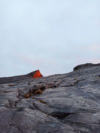 Rock formation on land against sky
