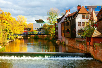 Pegnitz river cascade in nuremberg bavaria . houses situated on the riverside in germany