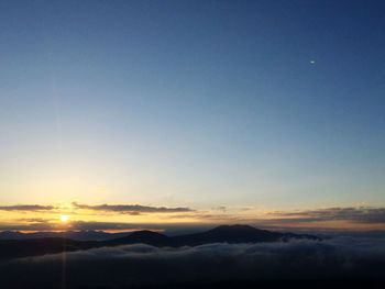 Scenic view of mountains against sky during sunset