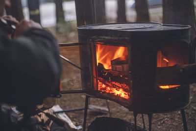 Man preparing food by camp stove