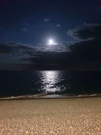 Scenic view of sea against sky at night