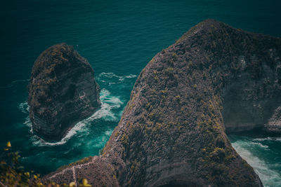 High angle view of rock formation in sea