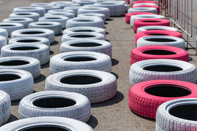 Car tires lying on the asphalt of a racing track for safety