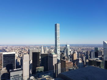 High angle view of cityscape against blue sky