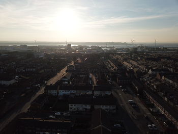 High angle view of city buildings during sunset