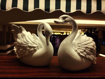 Close-up of swan on table