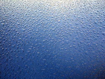 Full frame shot of raindrops on snow