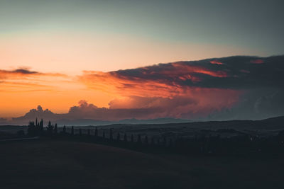 Scenic view of sea against romantic sky at sunset